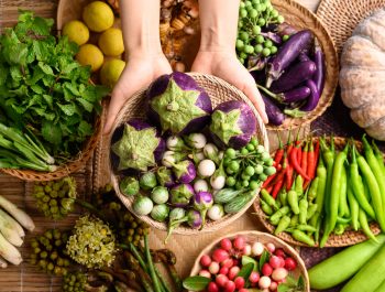 Organic Southeast Asian vegetables and spices from local farmer market in Thailand, Sustainability concept, Table top view